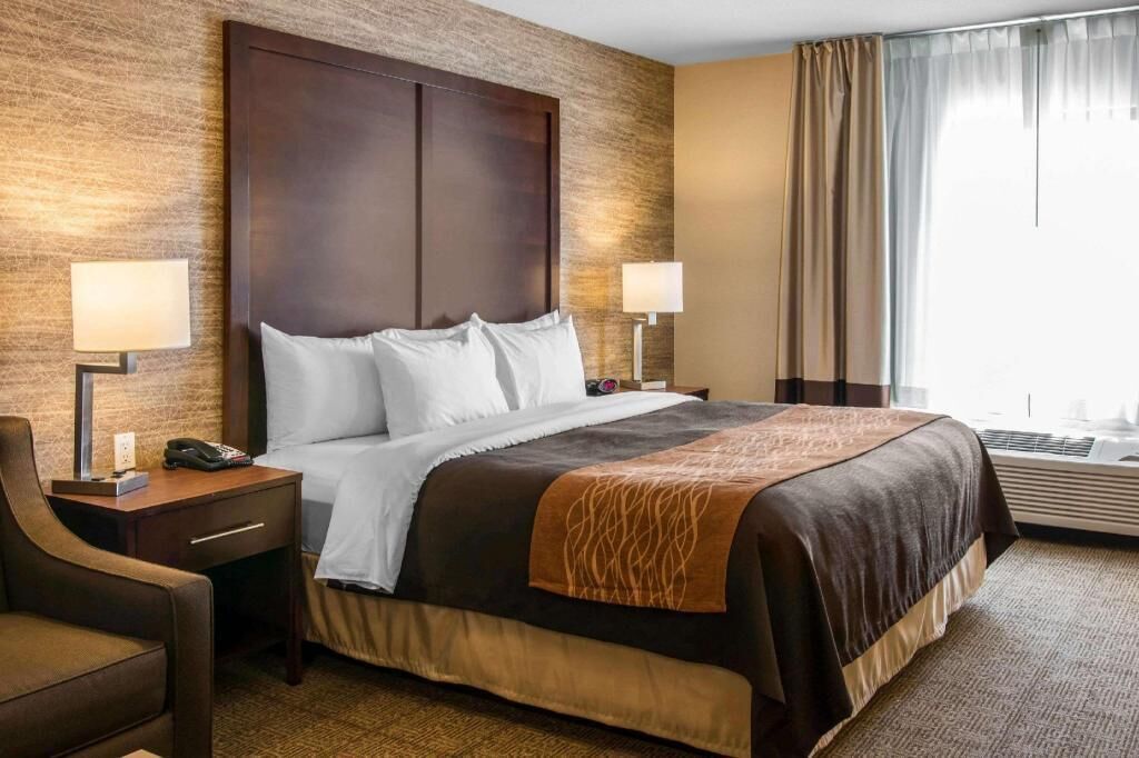 Premium bedding, desk, laptop workspace, iron/ironing board