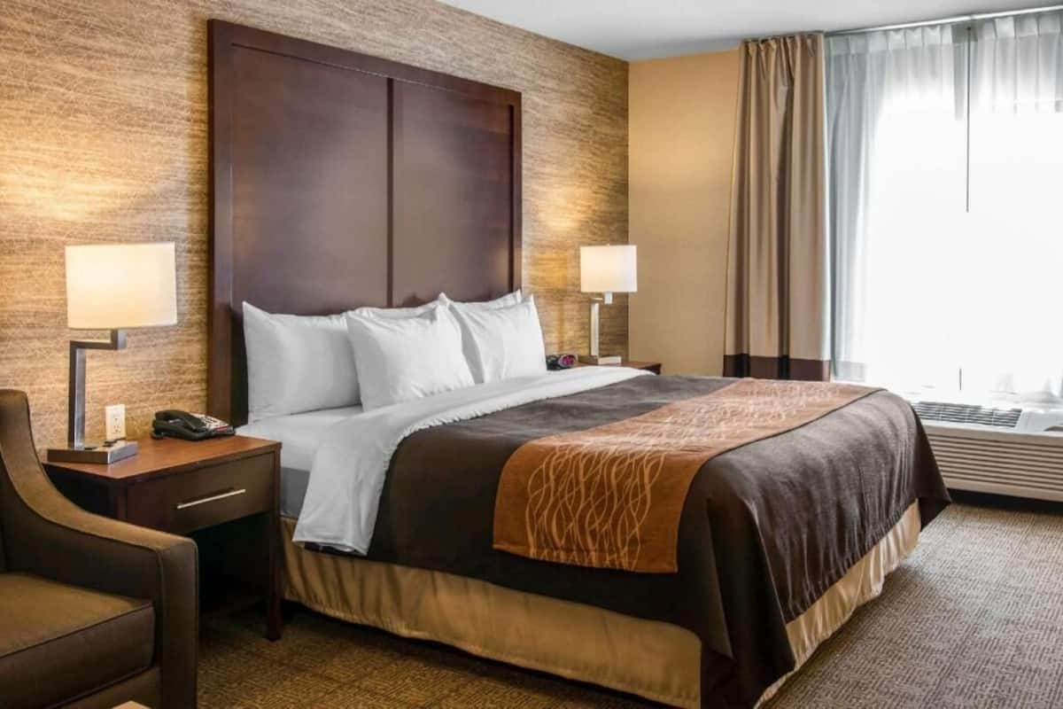 Premium bedding, desk, laptop workspace, iron/ironing board
