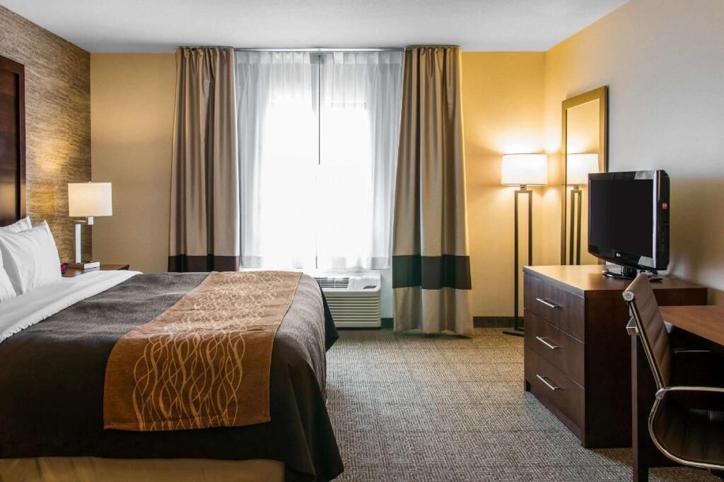 Premium bedding, desk, laptop workspace, iron/ironing board