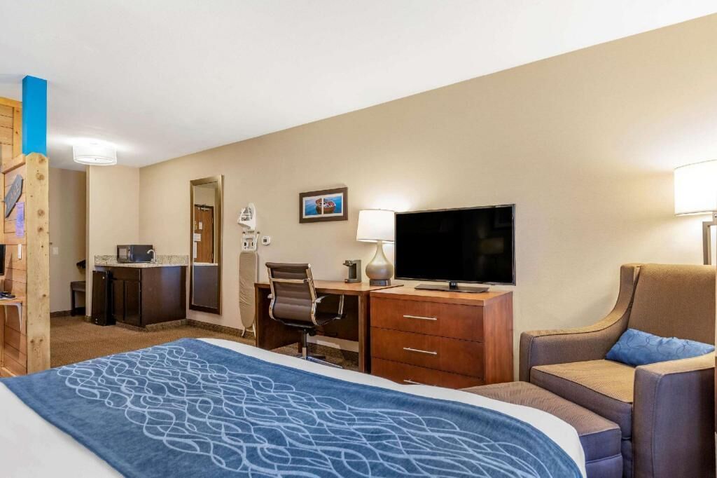 Premium bedding, desk, laptop workspace, iron/ironing board
