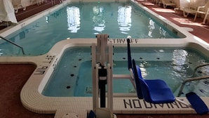 An indoor swimming pool with clear water, marked lanes, and a 'STAY OFF' sign. - Holiday Inn Express Birch Run - Frankenmuth Area by IHG (Birch Run)