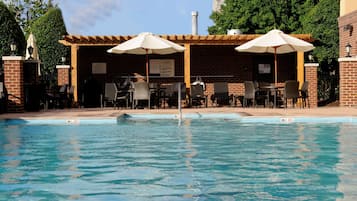 Seasonal outdoor pool, open 9:00 AM to 9:00 PM, pool loungers