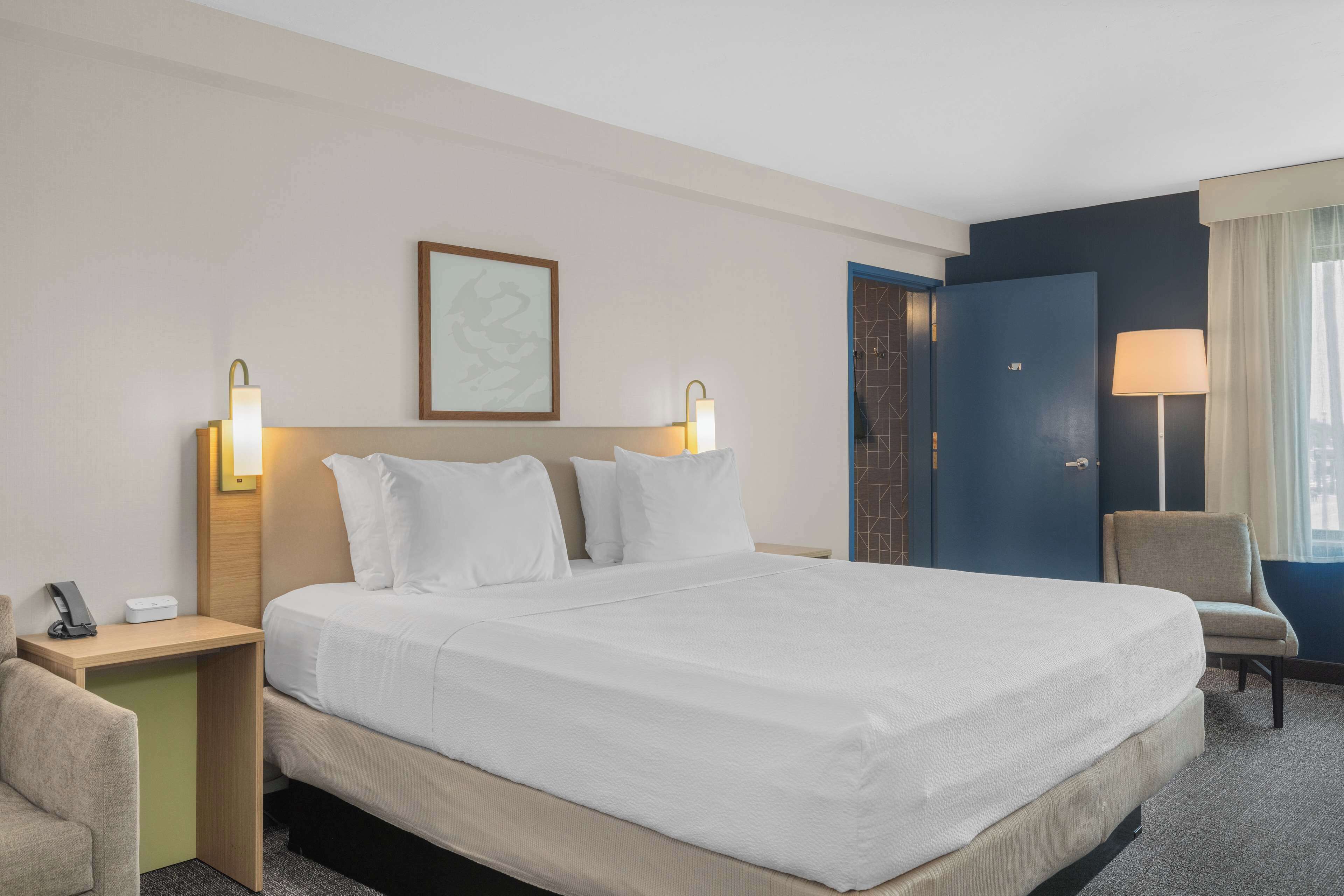 room, 1 king bed with sofa bed | premium bedding, iron/ironing board, free cots/infant beds