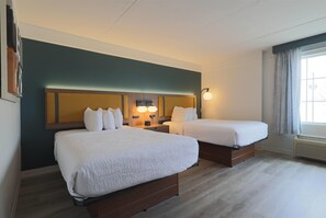 Premium bedding, pillow-top beds, desk, laptop workspace