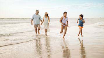 Enjoy a leisurely walk along the beach with family.