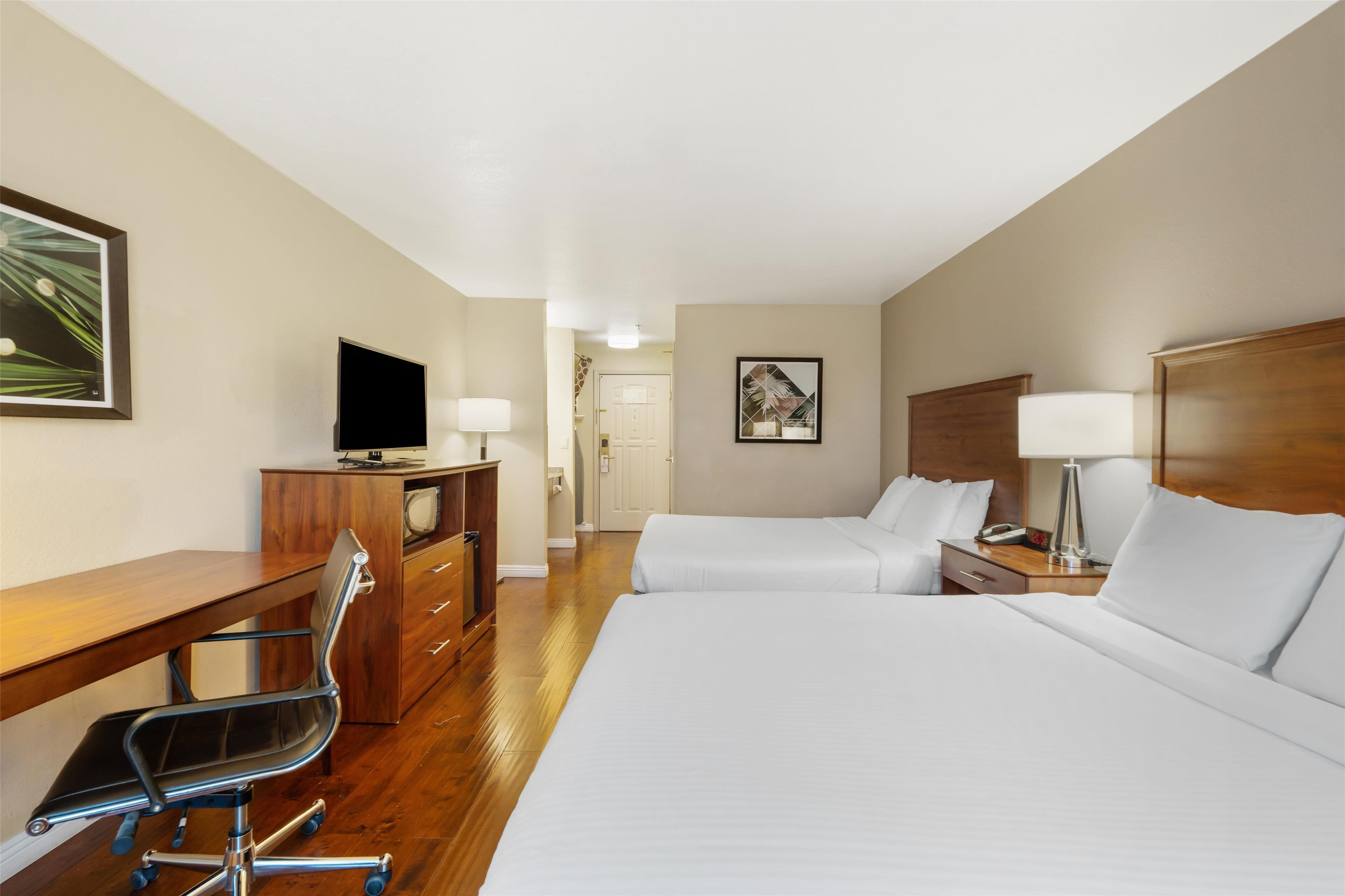 standard room, 2 queen beds, non smoking, refrigerator & microwave | 1 bedroom, in-room safe, blackout curtains, iron/ironing board