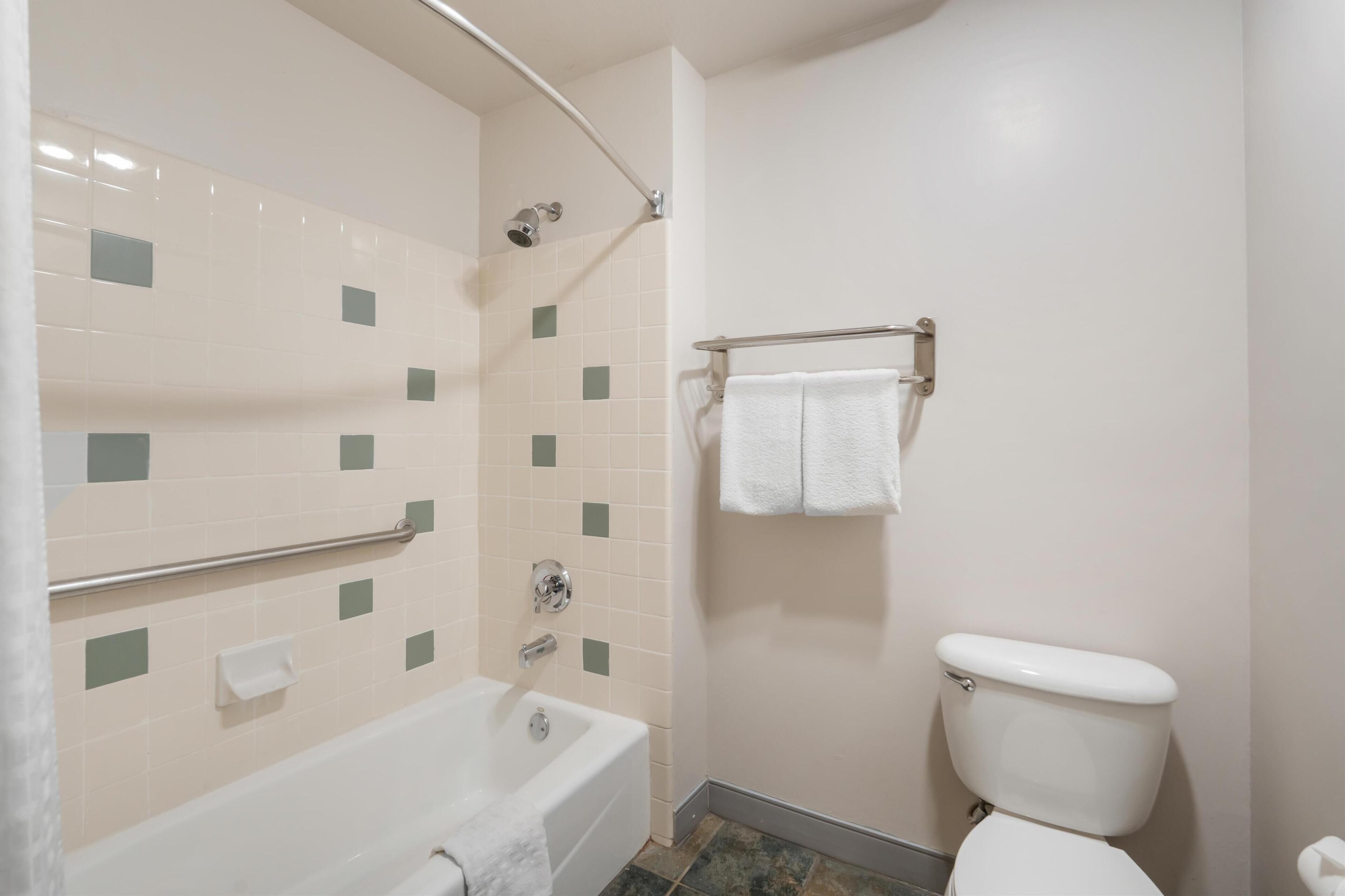 standard room, 2 queen beds, non smoking, refrigerator & microwave | bathroom | combined shower/bathtub, free toiletries, hair dryer, towels