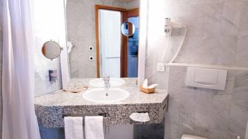 Hair dryer, towels, soap, shampoo