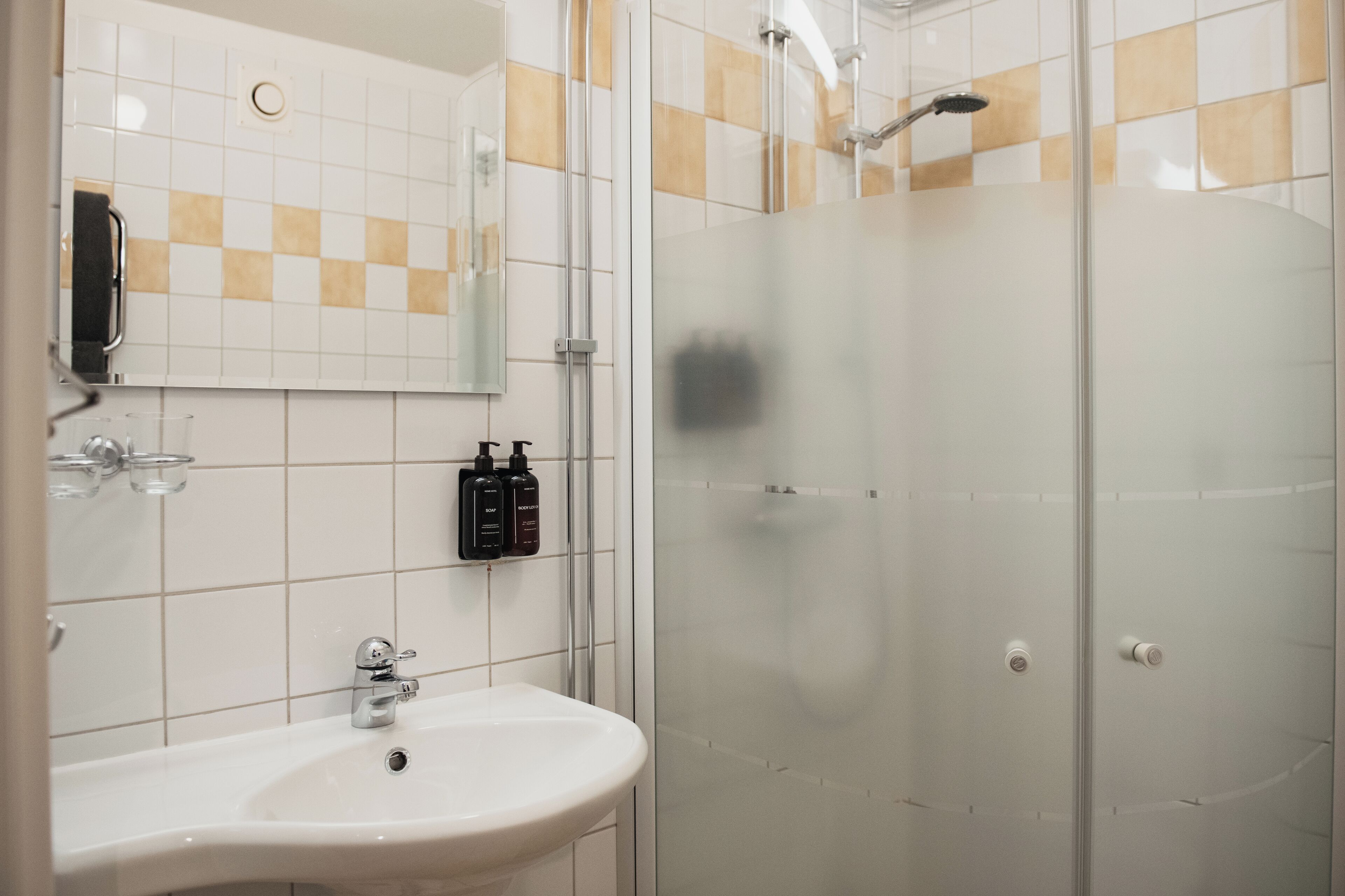 deluxe double room, 1 double bed with sofa bed | bathroom | hair dryer, towels, soap, shampoo