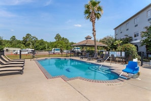 Outdoor pool, open 9:00 AM to 10:00 PM, pool umbrellas, sun loungers