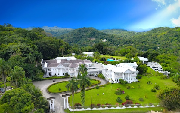 Set amidst lush greenery and rolling hills, this colonial-style complex offers a serene escape with a swimming pool and beautifully maintained lawns.