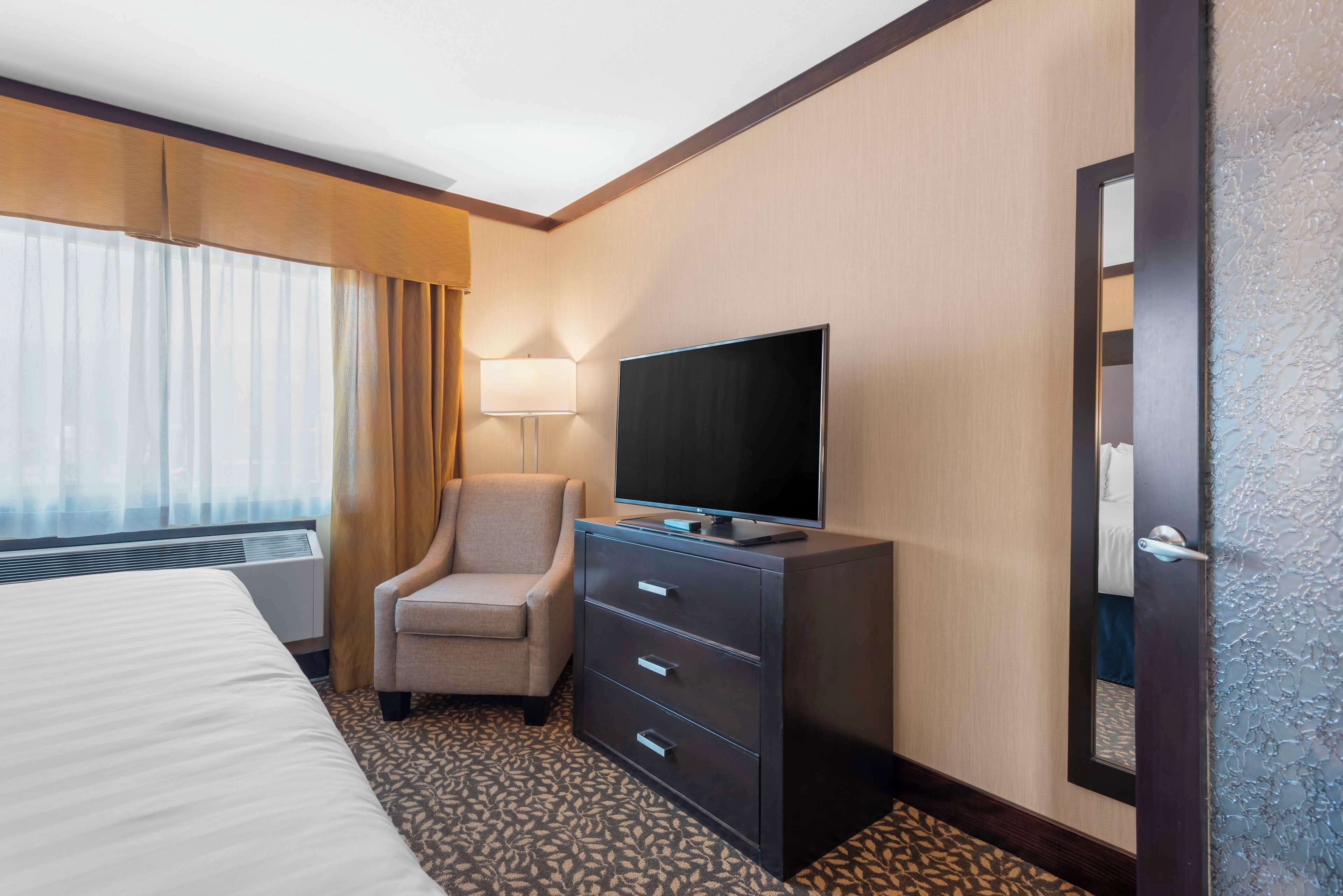 business suite, 1 king bed, non smoking, fireplace | desk, laptop workspace, iron/ironing board, free wifi