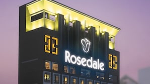 A hotel with a prominent 'Rosedale' sign, multiple floors, and a modern architectural design. - Rosedale Hotel Hong Kong (Hong Kong)