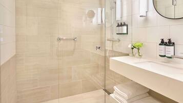Shower, designer toiletries, hair dryer, bathrobes
