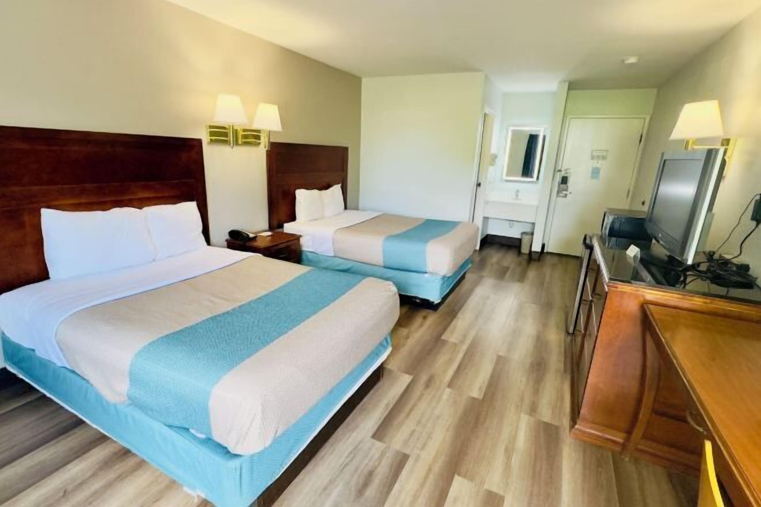 Desk, laptop workspace, blackout curtains, iron/ironing board