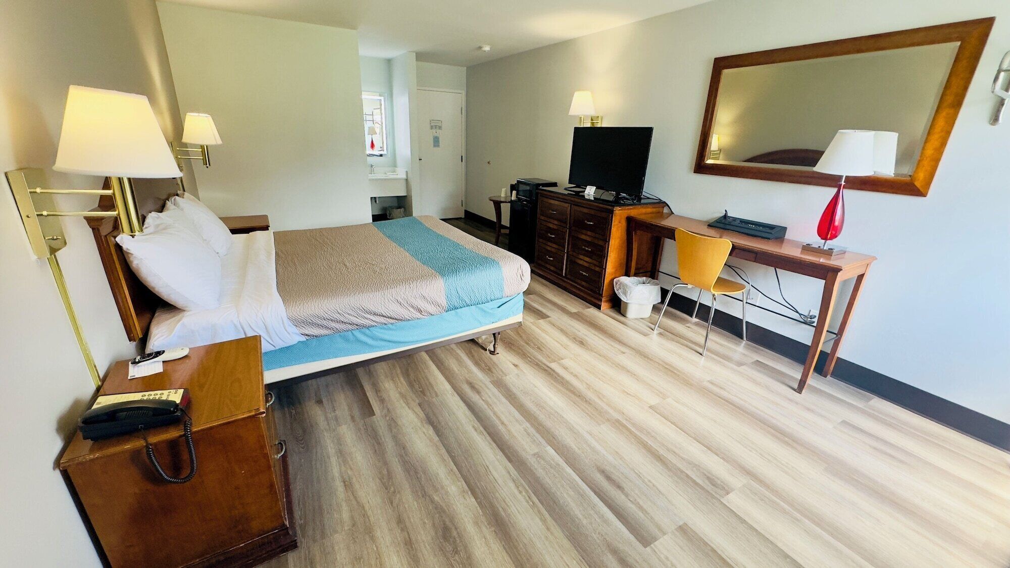 Desk, laptop workspace, blackout curtains, iron/ironing board