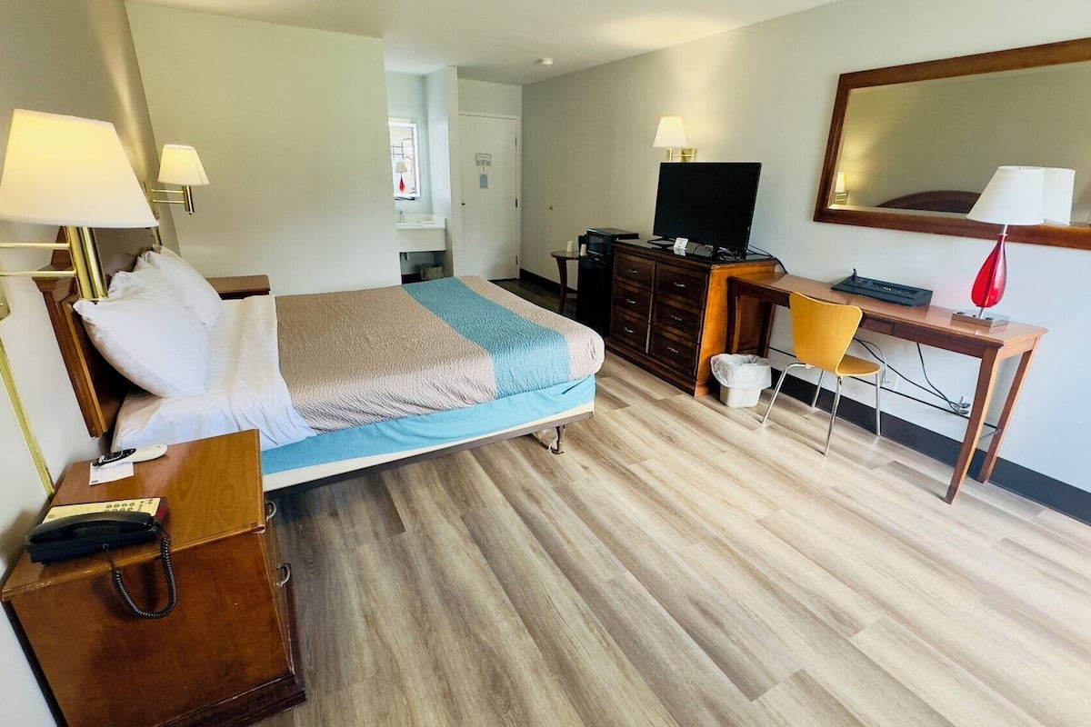 Desk, laptop workspace, blackout curtains, iron/ironing board