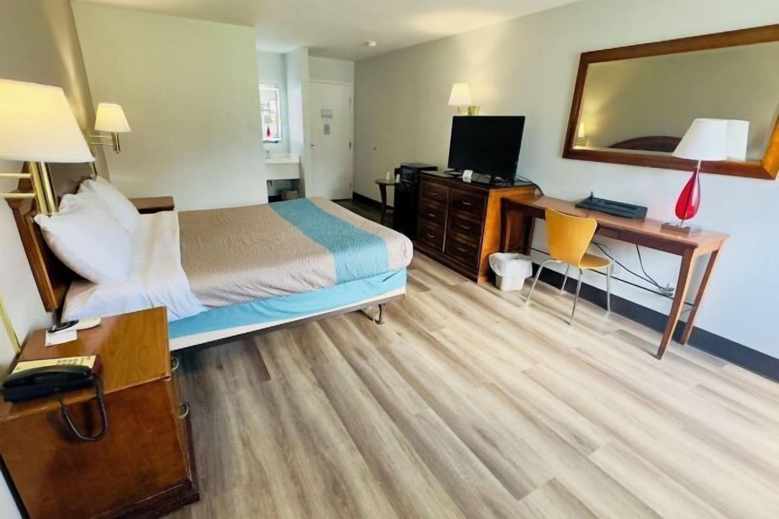 Desk, laptop workspace, blackout curtains, iron/ironing board