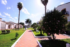 Stroll through the serene courtyard, surrounded by lush greenery and tranquil ambiance.