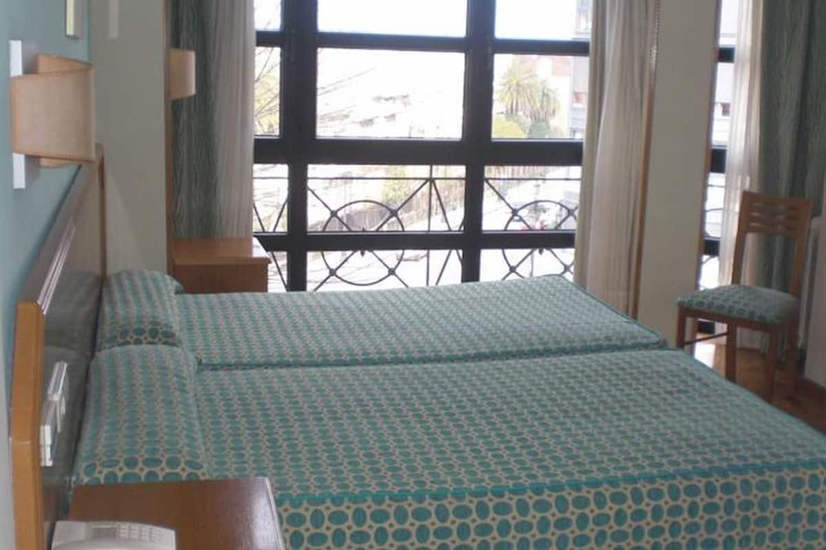 Down comforters, desk, WiFi (free), bed sheets