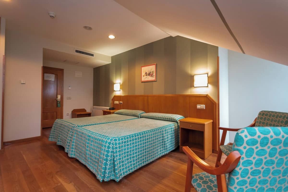 Down comforters, desk, WiFi (free), bed sheets