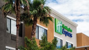 A Holiday Inn Express building with a modern design, large windows, and palm trees in front. - Holiday Inn Express & Suites Nogales by IHG (Nogales)