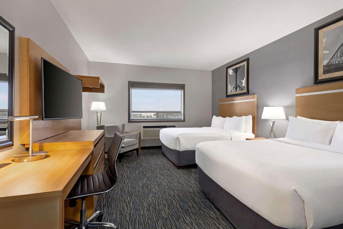 Down comforters, pillowtop beds, desk, laptop workspace