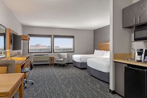 Down comforters, pillowtop beds, desk, laptop workspace
