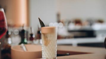 A clear glass with a textured pattern, placed on a wooden surface.