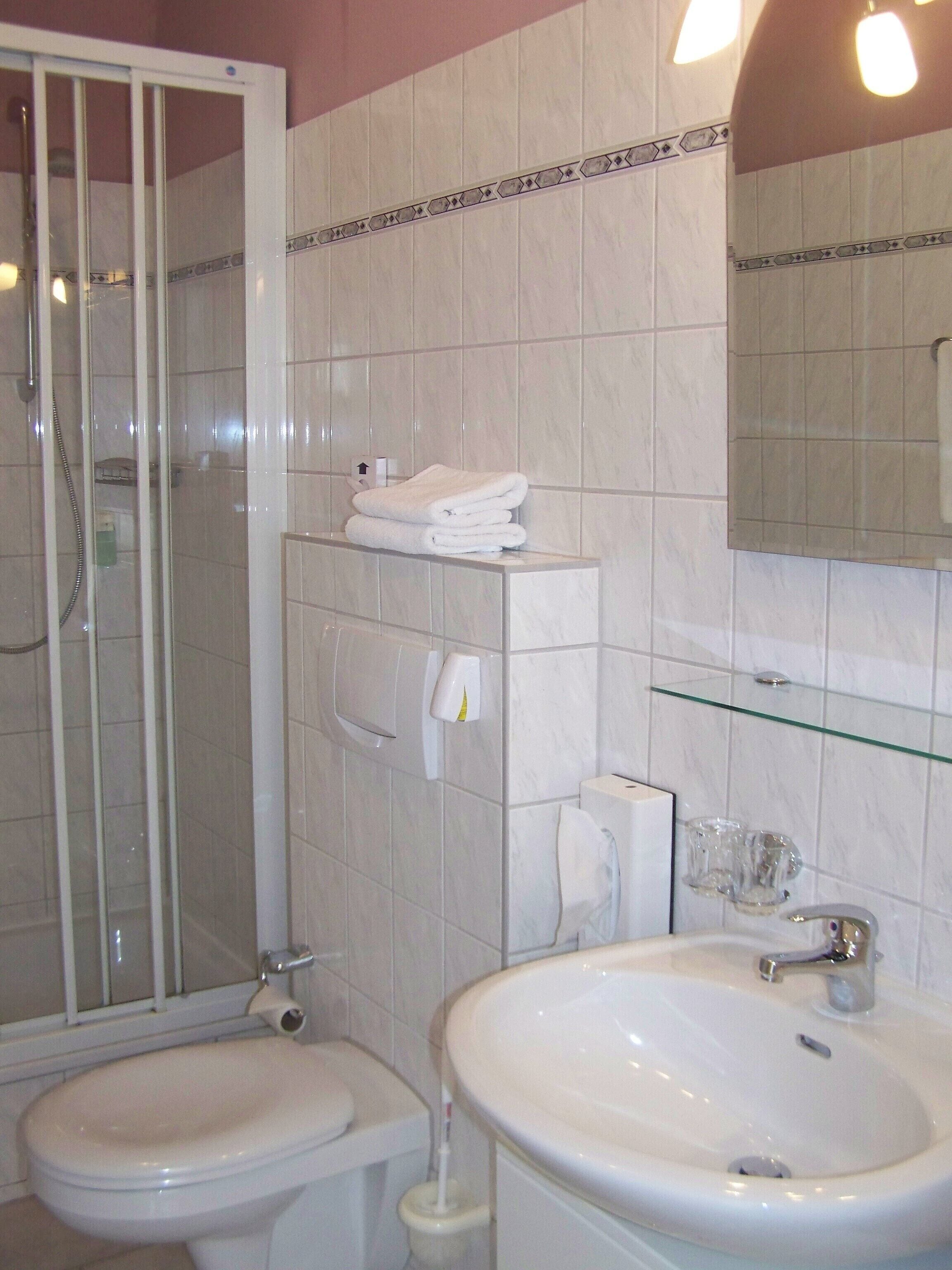 shower, rainfall showerhead, hair dryer, towels