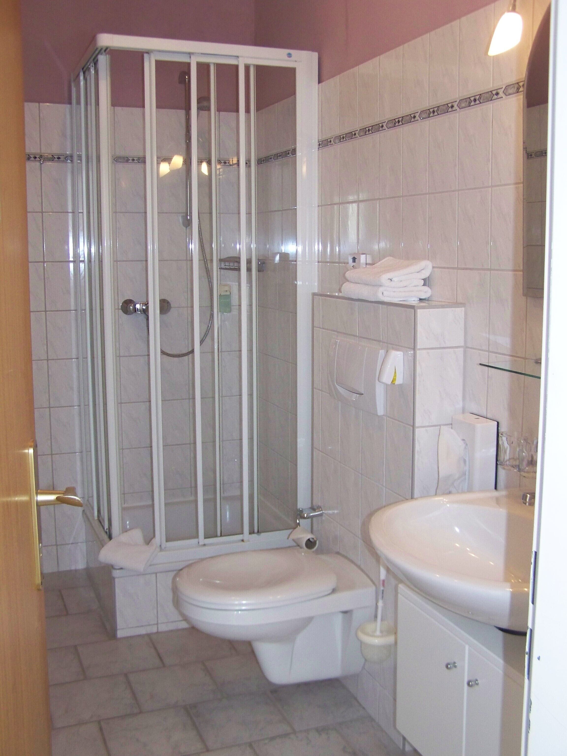 double room | bathroom | shower, rainfall showerhead, hair dryer, towels