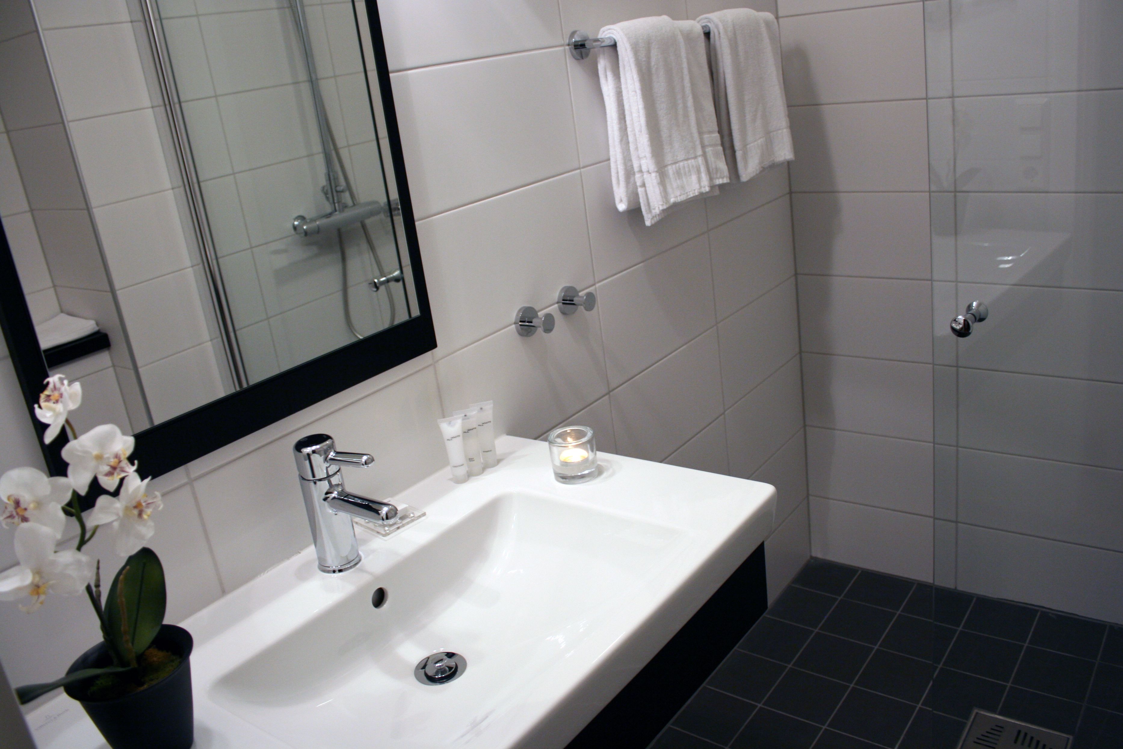 classic double room | bathroom | shower, hair dryer, towels