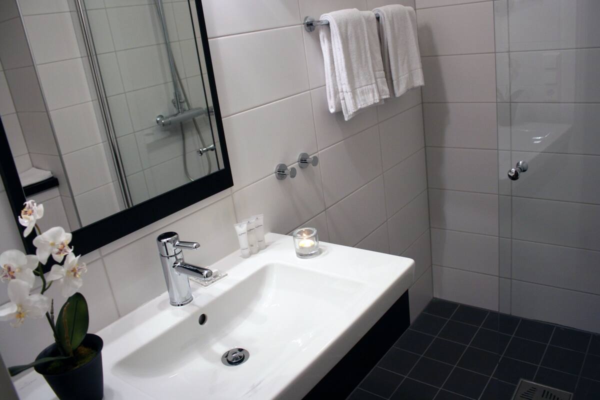 classic double room | bathroom | shower, hair dryer, towels