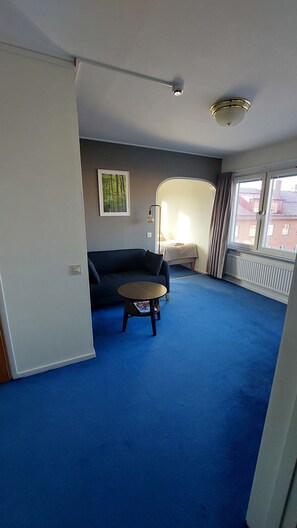 Family Twin Room | Living area | Flat-screen TV