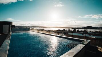 2 outdoor pools, open 9:00 AM to 10:00 PM, pool loungers