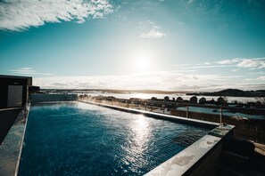 2 outdoor pools, open 9:00 AM to 10:00 PM, pool loungers