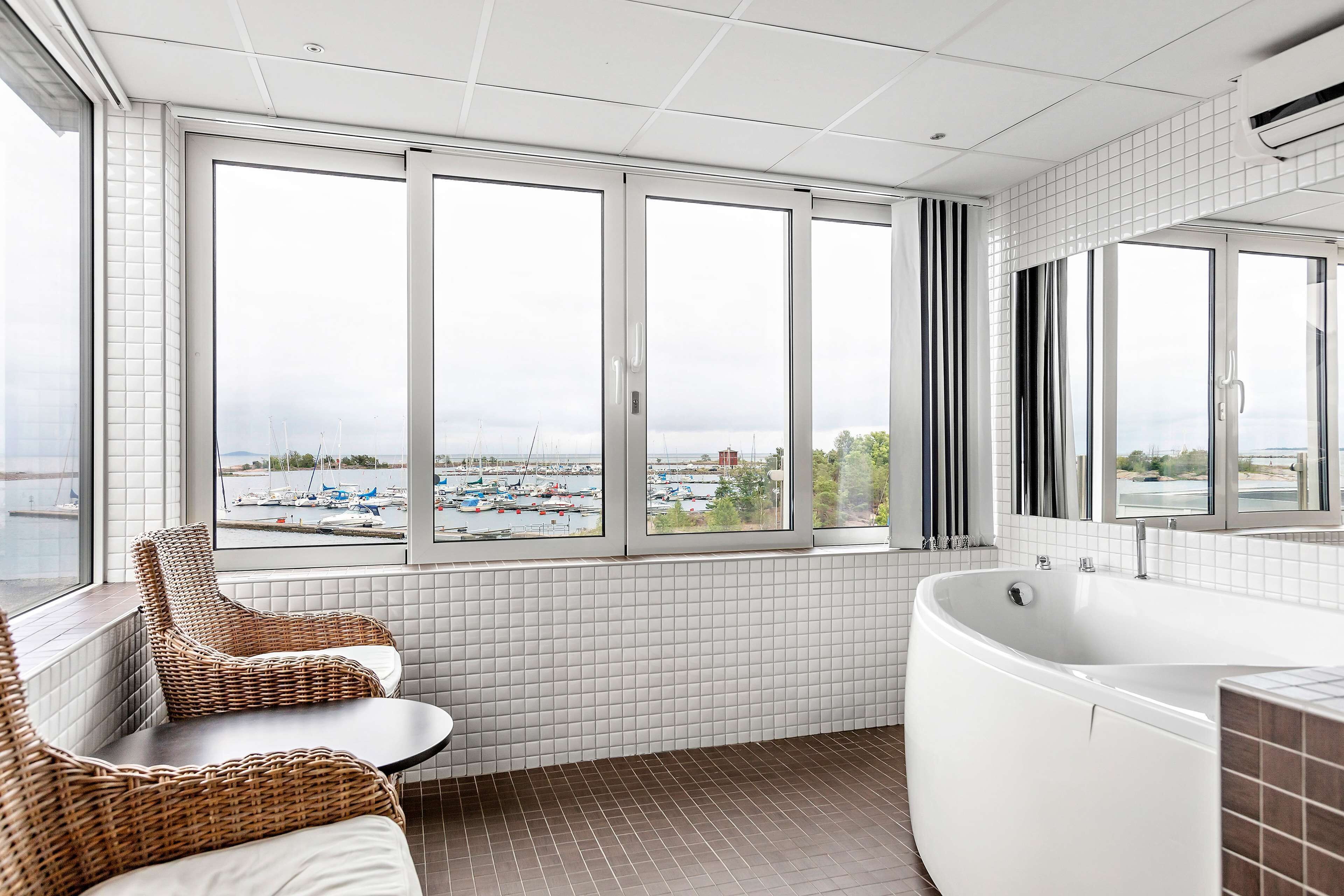 suite, 1 queen bed, jetted tub, sea view | bathroom | hair dryer, towels
