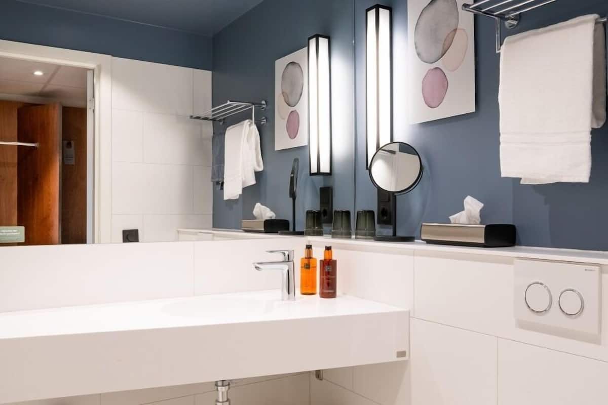 superior twin room | bathroom | shower, hair dryer, towels