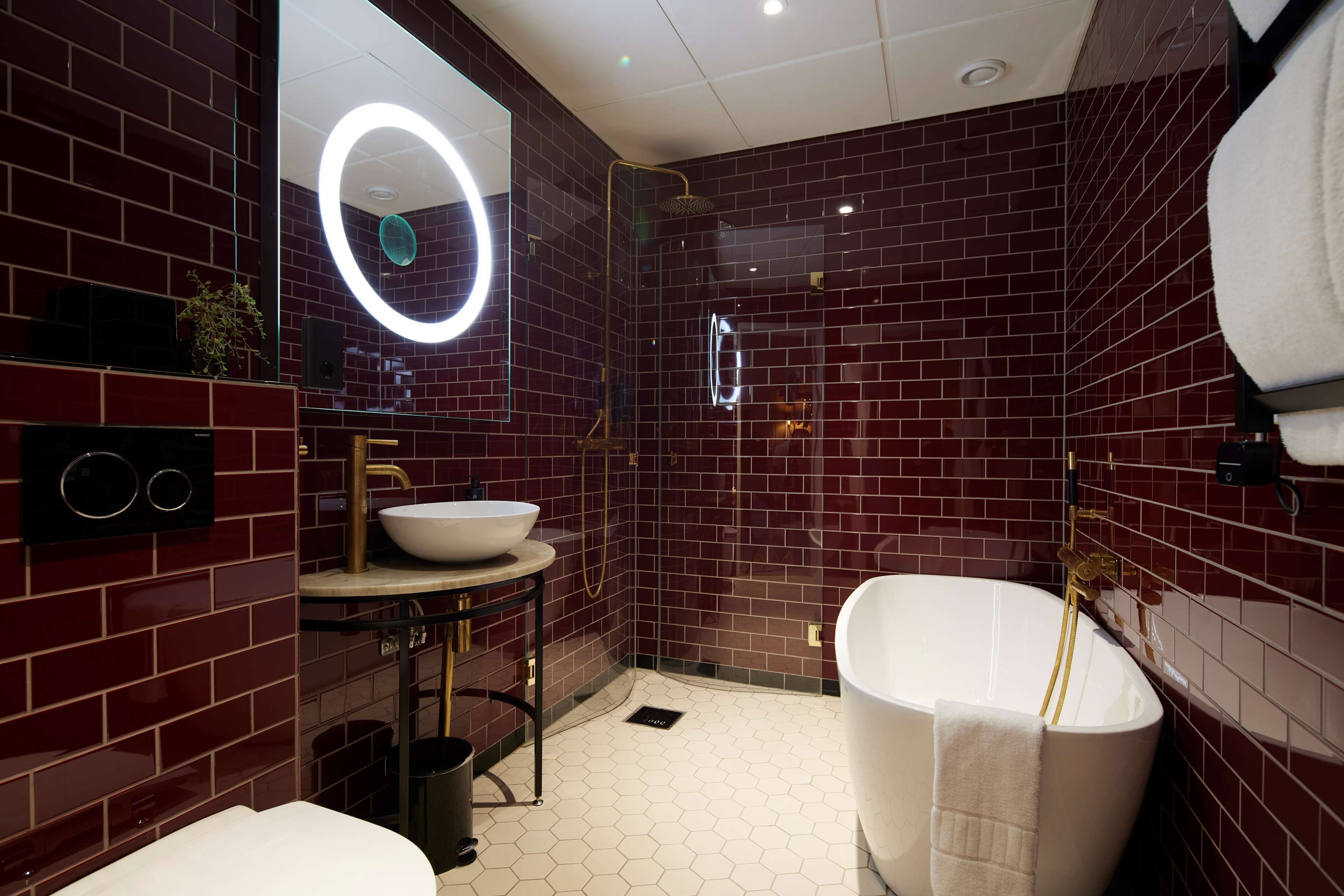 suite, 1 king bed, non smoking | bathroom | hair dryer, heated floors, towels, soap