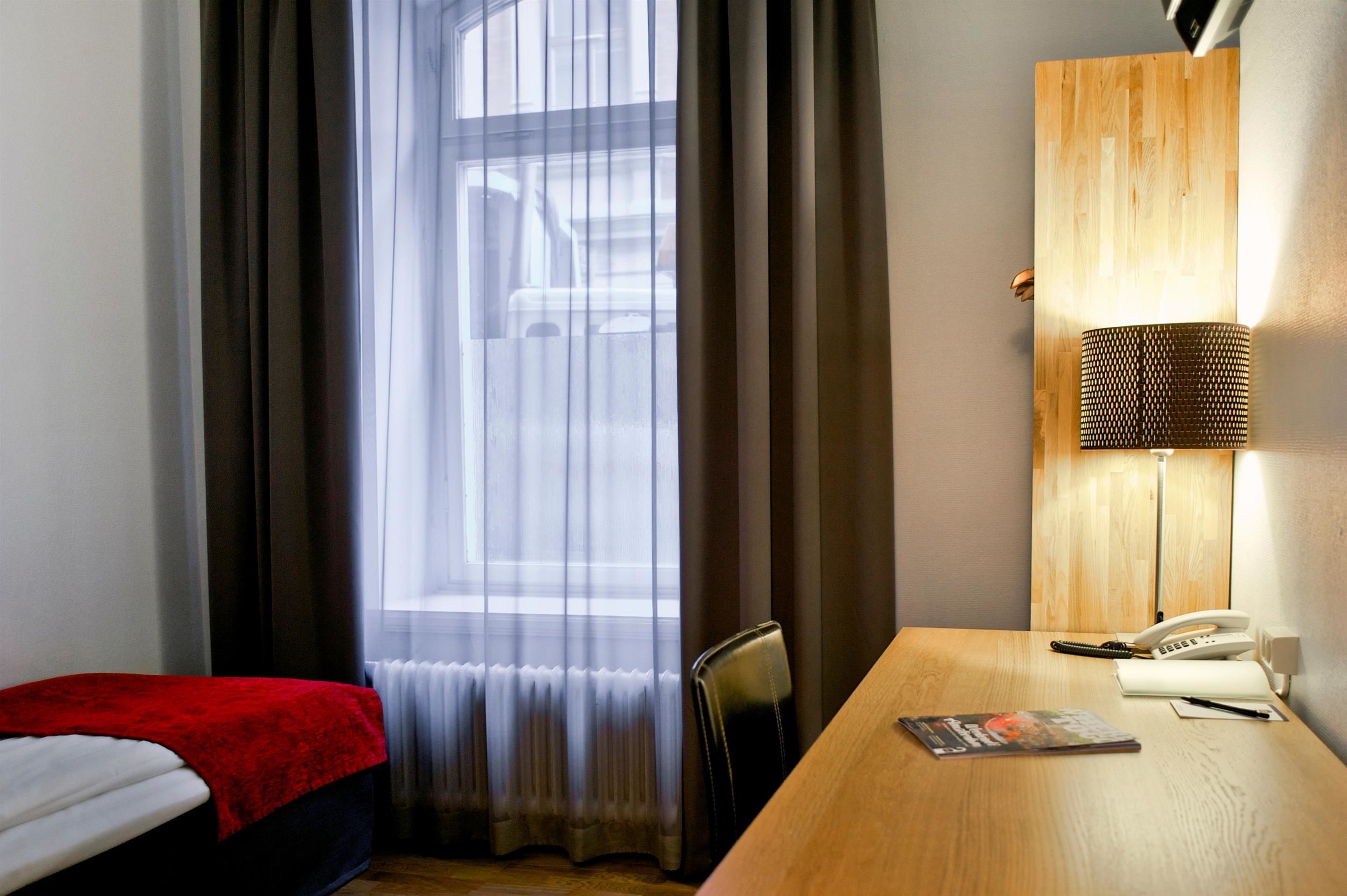 economy room, 1 single bed, non smoking | 1 bedroom, desk, blackout curtains, iron/ironing board