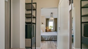A bedroom with a bed, a chair, a desk, and a window. - First Hotel Brommaplan (Bromma)