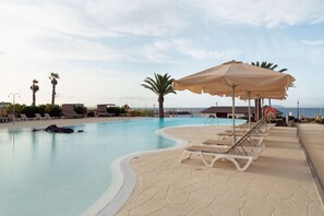Indoor pool, 8 outdoor pools, open 9:00 AM to 7:00 PM, pool umbrellas