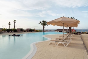 Indoor pool, 8 outdoor pools, open 9:00 AM to 7:00 PM, pool umbrellas