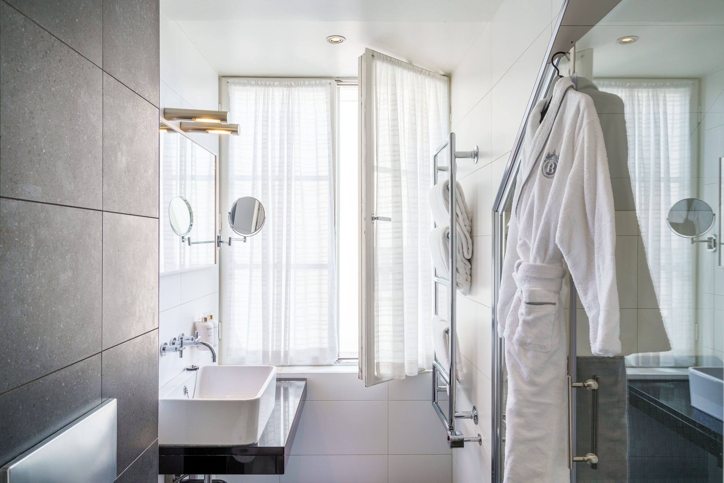 deluxe signature | bathroom | eco-friendly toiletries, hair dryer, towels, soap