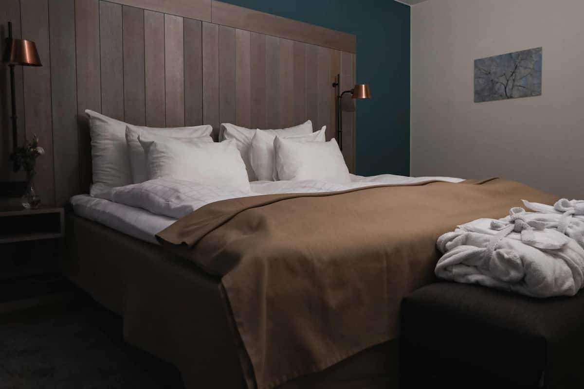 Hypo-allergenic bedding, desk, laptop workspace, blackout curtains