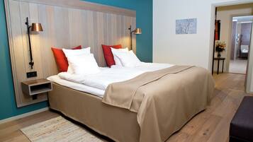 Hypo-allergenic bedding, desk, laptop workspace, blackout drapes