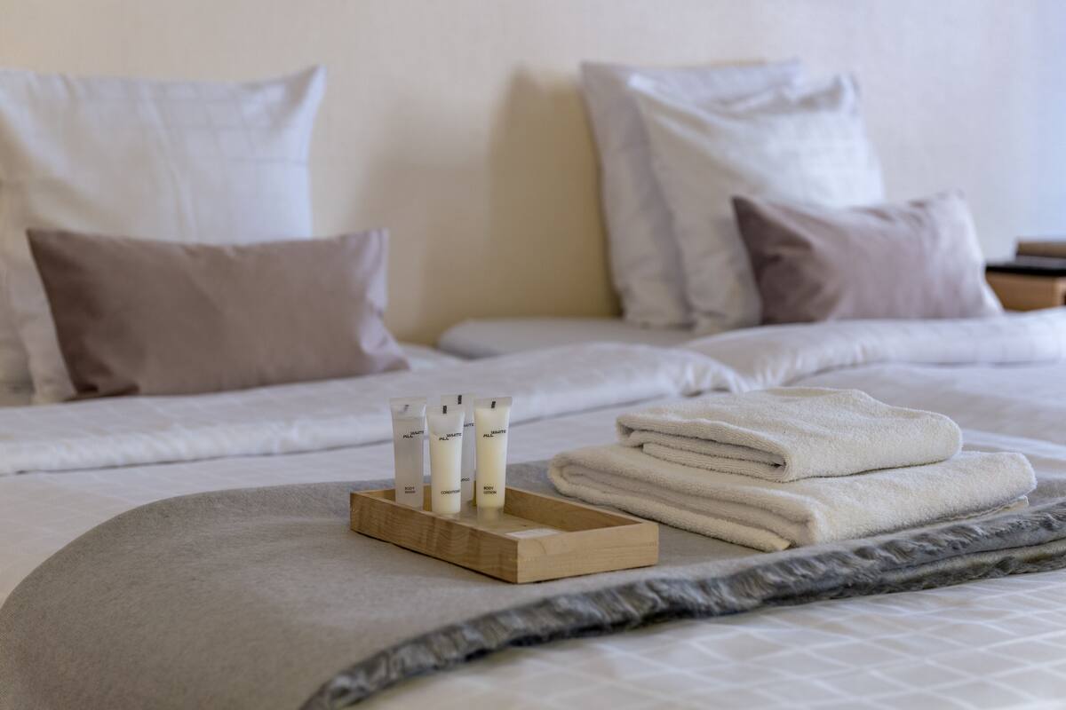 Desk, blackout curtains, free cots/infant beds, free WiFi