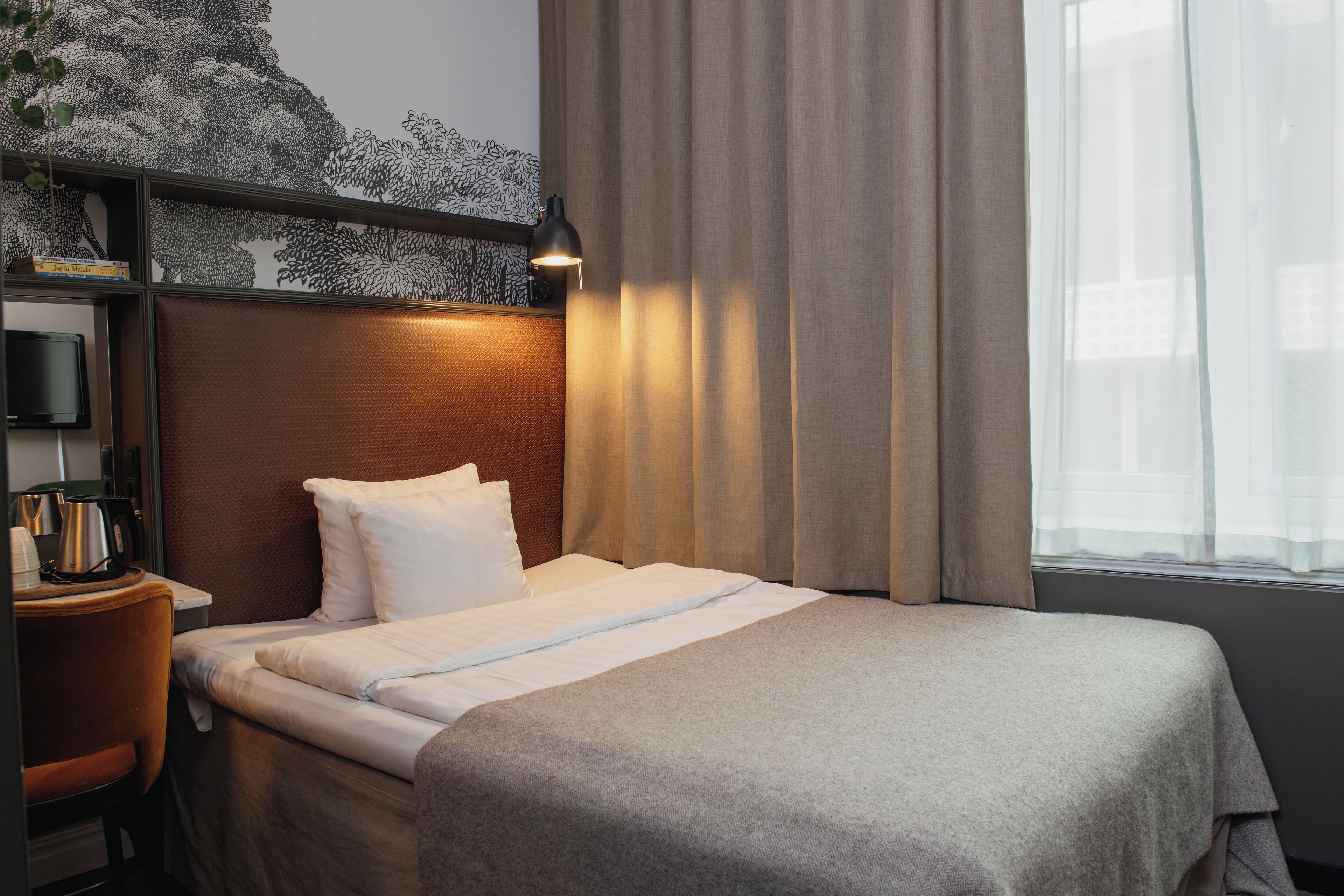 Desk, blackout curtains, iron/ironing board, cots/infant beds