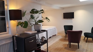Family Room, Ground Floor | Minibar, iron/ironing board, free WiFi, bed sheets