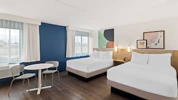 Desk, blackout drapes, iron/ironing board, free cribs/infant beds